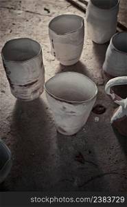 handmade ceramics, empty craft ceramic cup on gray background . handmade ceramics, empty craft ceramic cup