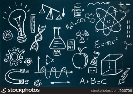Handmade chemist and mathematical drawings on blackboard background. Chemist and mathematical drawings on blackboard background