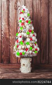 Handmade Christmas tree over wooden background, copy space