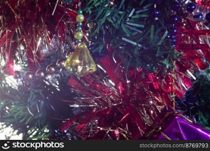 Handmade DIY Christmas decorations on a tree, macro shot close-up