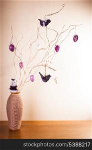 Handmade easter decorations on the branches in vase