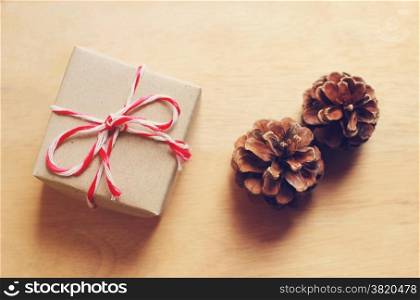 Handmade gift box and pine cone with retro filter effect