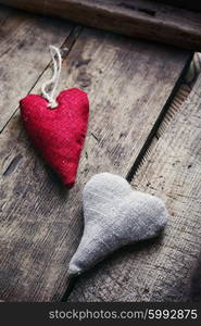 Handmade heart fabric Valentine&amp;#39;s day on wooden table.Photo low key.Selective focus