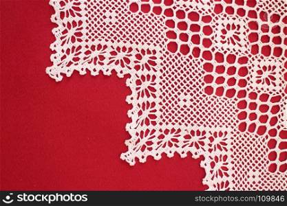 handmade lace on red flat lay