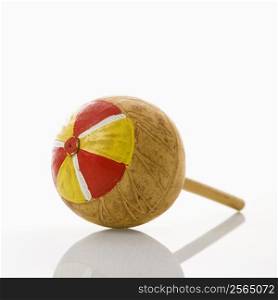 Handmade Mexican maraca percussion musical instrument against white background.