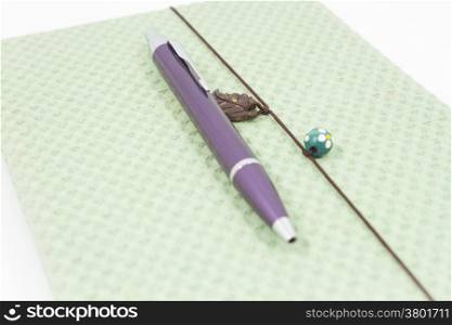 Handmade notebook with pen isolated on white background, stock photo