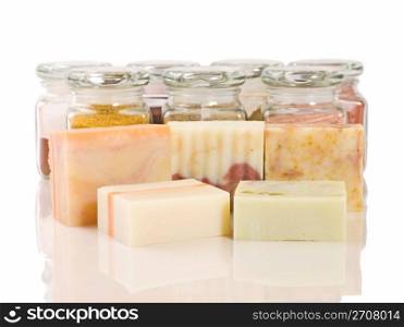 handmade soap and its raw materials in glass (Lavender, Calendula, and Chamomile)