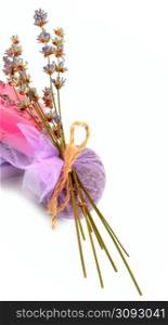 Handmade soap and sachet of lavender flowers isolated on white background. Free space for text. Vertical photo.