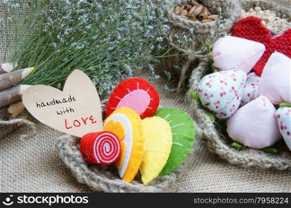 Handmade with love background, vintage style, amazing design with flower pot, knitted basket from burlap, fibre strawberry, colorful hand made fruit and cake
