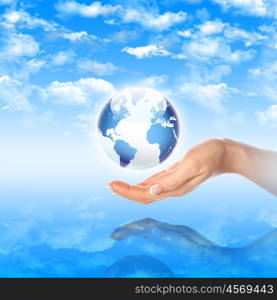 Hands and Earth. Symbol of environmental protection