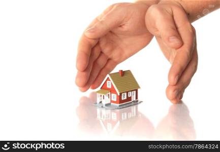 Hands and little house. Isolated on white backgrouns.