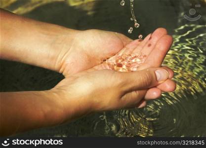 Hands Being Rinsed By Water