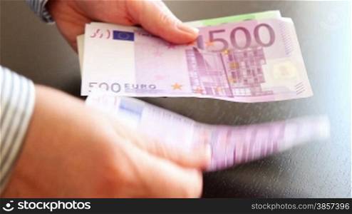 Hands counting euro money