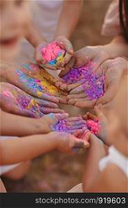 Hands covered in tempura paint. Focus is on hands. Hands covered in paint. Focus is on hands