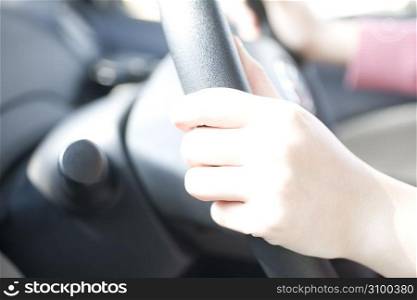 hands driving with wheel
