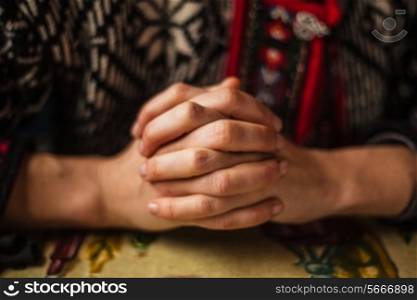Hands folded in prayer