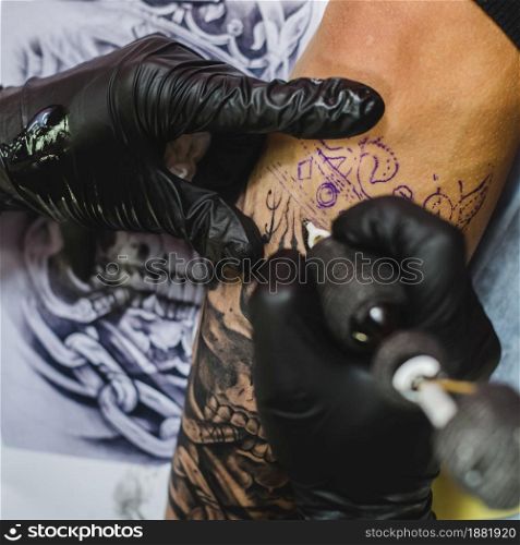 hands gloves doing tattoo