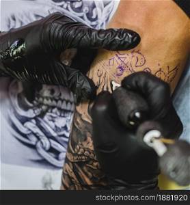 hands gloves doing tattoo