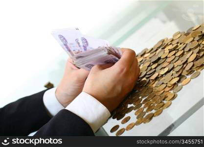 hands hold russian rouble money on white background
