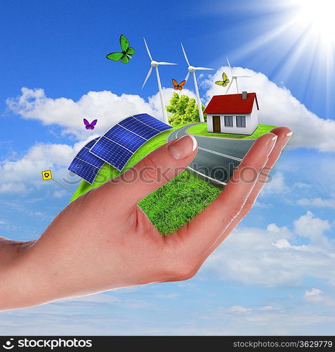 Hands holding a green earth with solar batareis