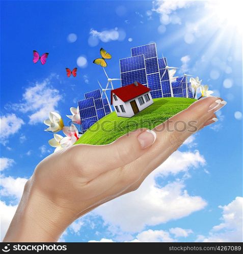 Hands holding a green earth with solar batareis