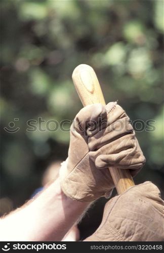 Hands Holding a Shovel Handle