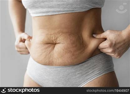 hands holding body fat. High resolution photo. hands holding body fat