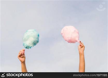 hands holding cotton candy. High resolution photo. hands holding cotton candy. High quality photo