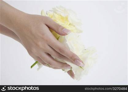 Hands holding flowers
