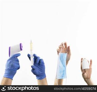 hands holding medicine items