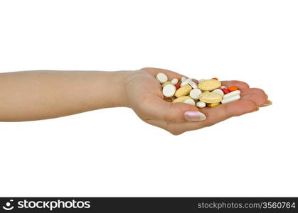 Hands holding pills on white