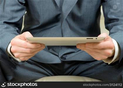 hands holding the tablet computer