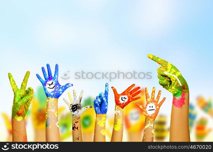 Hands in paint. Image of human hands in colorful paint with smiles