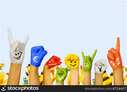Hands in paint. Image of human hands in colorful paint with smiles