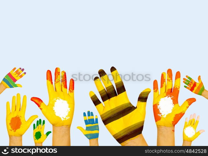 Hands in paint. Image of human hands in colorful paint with smiles