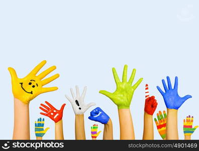 Hands in paint. Image of human hands in colorful paint with smiles