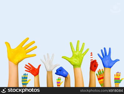 Hands in paint. Image of human hands in colorful paint with smiles