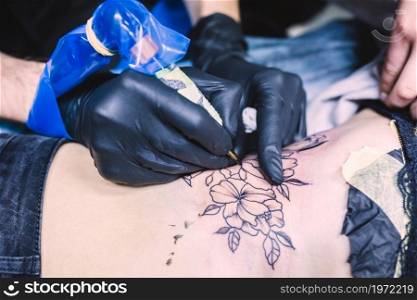 hands making tattoo with machine. High resolution photo. hands making tattoo with machine. High quality photo