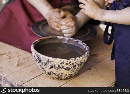 Hands of a potter shaping clay, detail of craftsman, art and creation in Spain