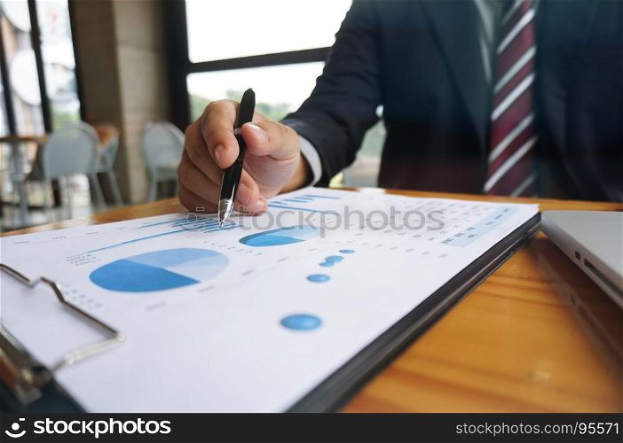 Hands of business people analyzing chart Finance managers task