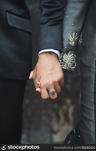 hands of groom and bride