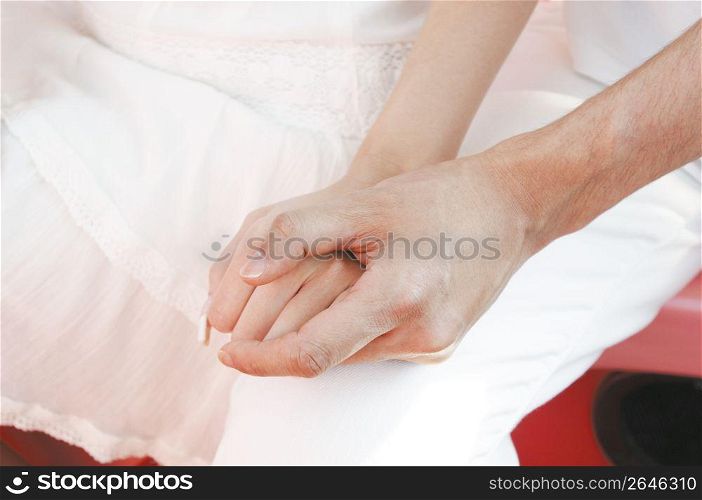 Hands of Japanese couple