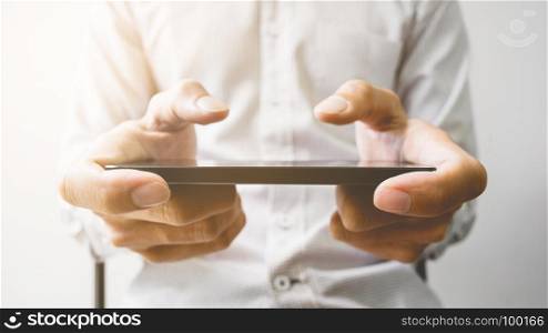hands of man watching mobile smart phone - device technology and gadget concept