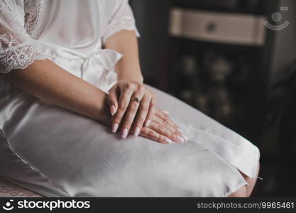 Hands of newlyweds with wedding rings.. Delicate hands with wedding rings 2164.