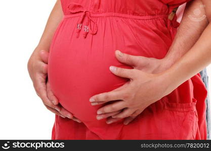 Hands of pregnant woman and her husband