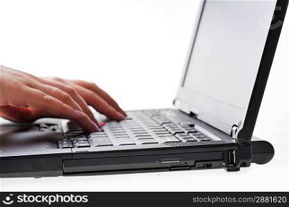 hands of woman typing on laptop keyboard