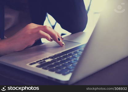 hands of young woman using laptop shopping and entertainment concept.