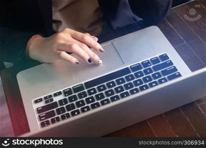 hands of young woman using laptop shopping and entertainment concept.
