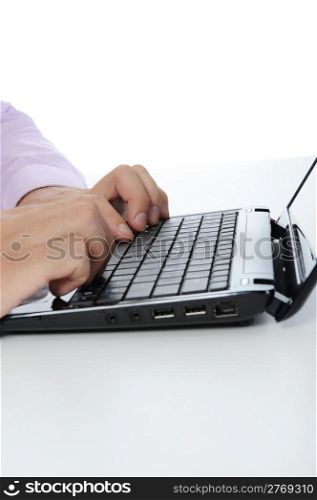 Hands on the laptop keyboard. Isolated on white