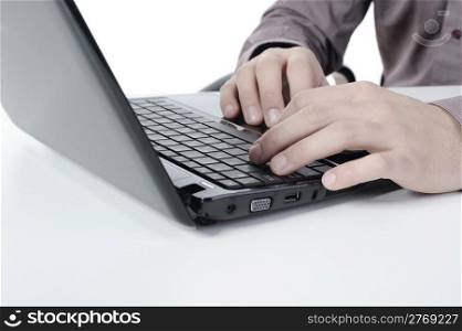 Hands on the laptop keyboard. Isolated on white background